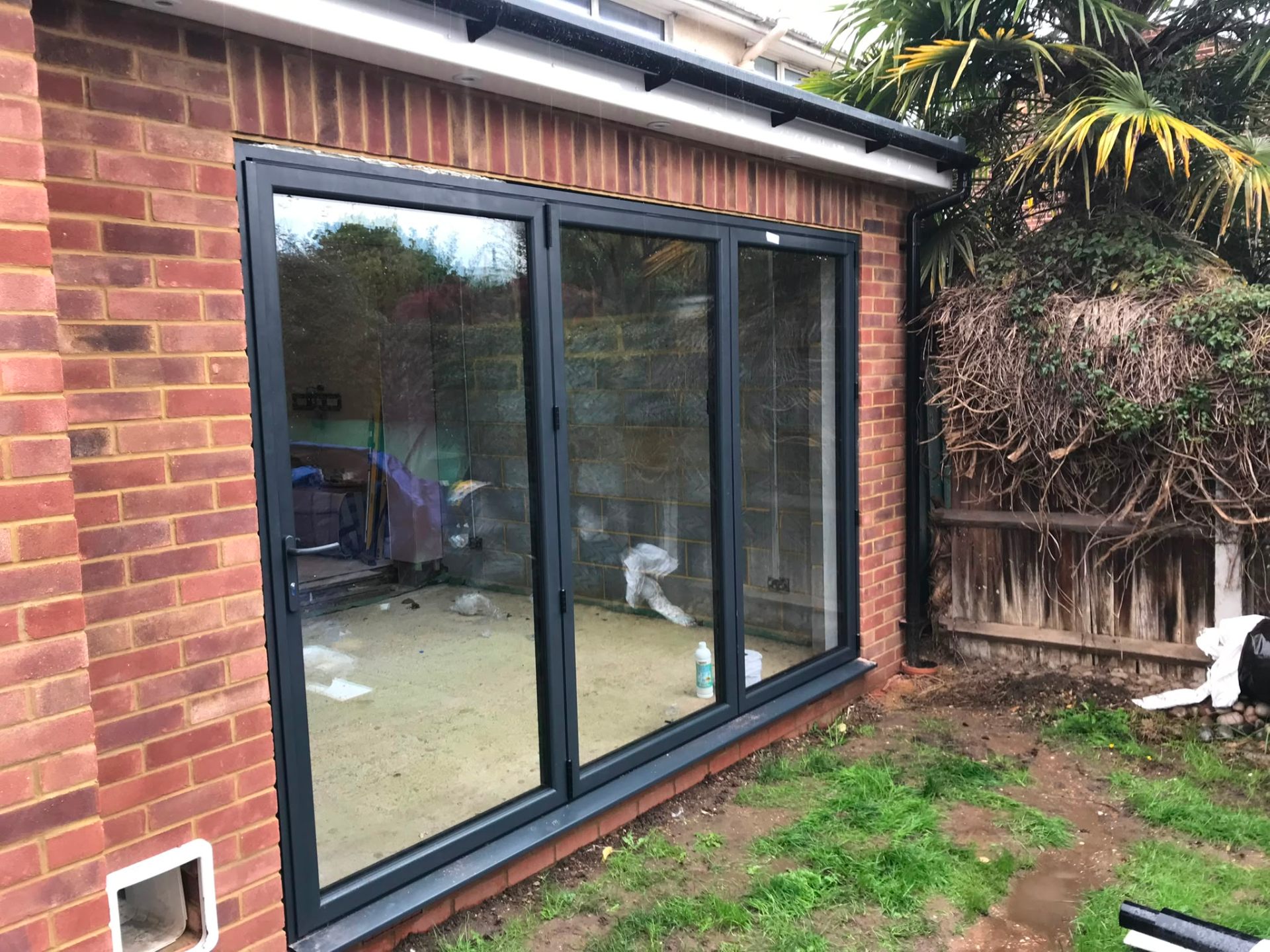 Aluminium bi-fold doors installation by Rural Windows in Chester & North Wales