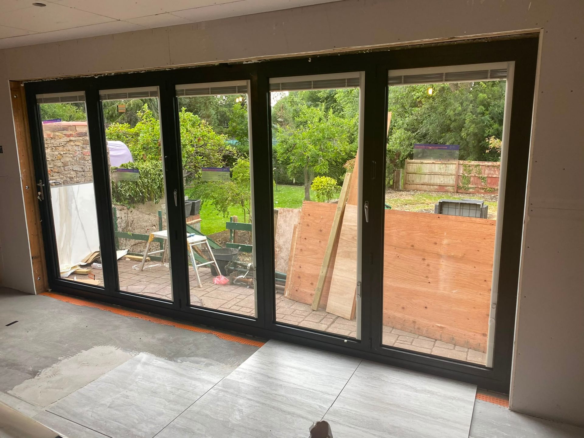 Aluminium bi-fold doors installation by Rural Windows in Chester & North Wales