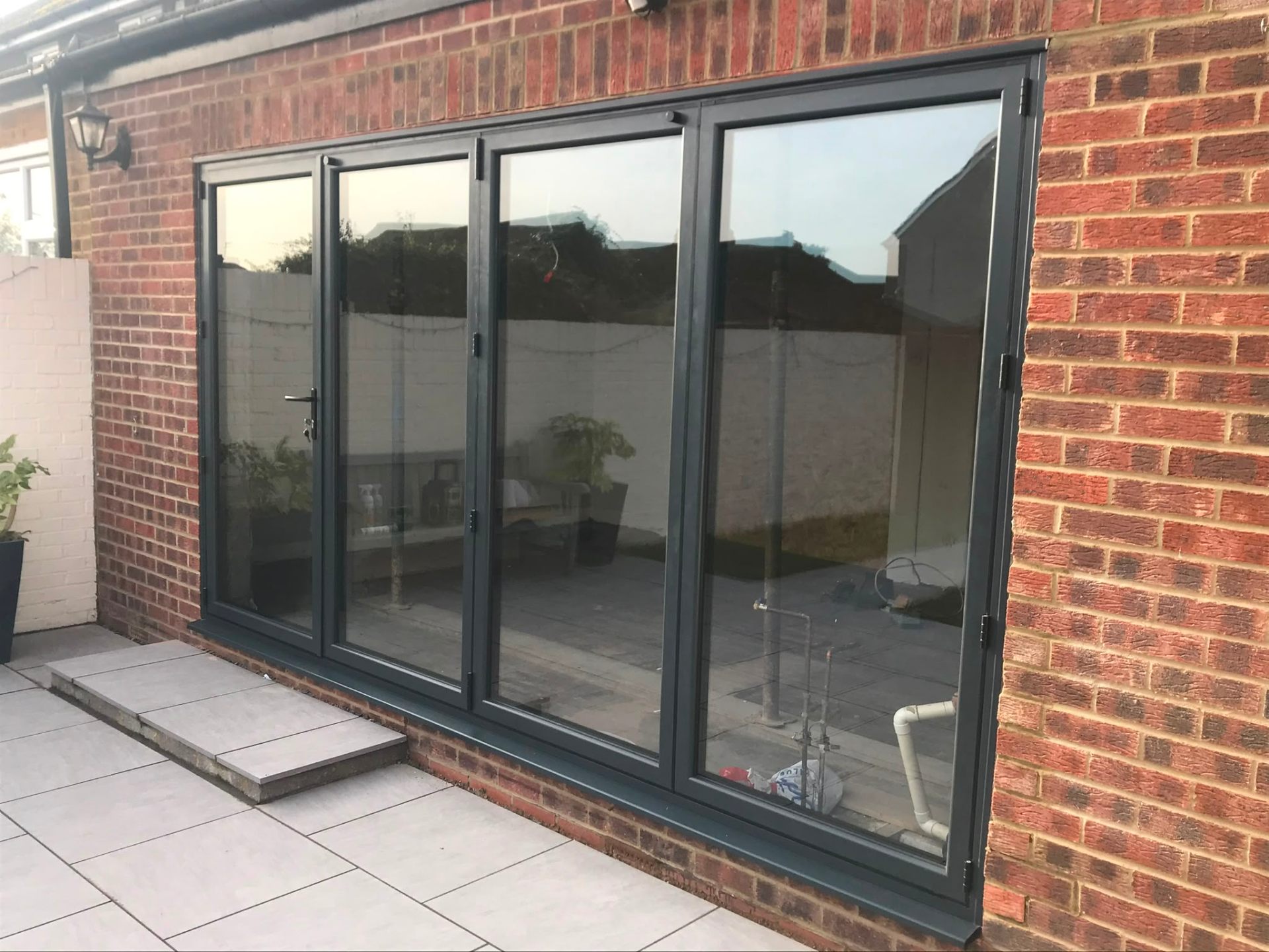 Aluminium bi-fold doors installation by Rural Windows in Chester & North Wales