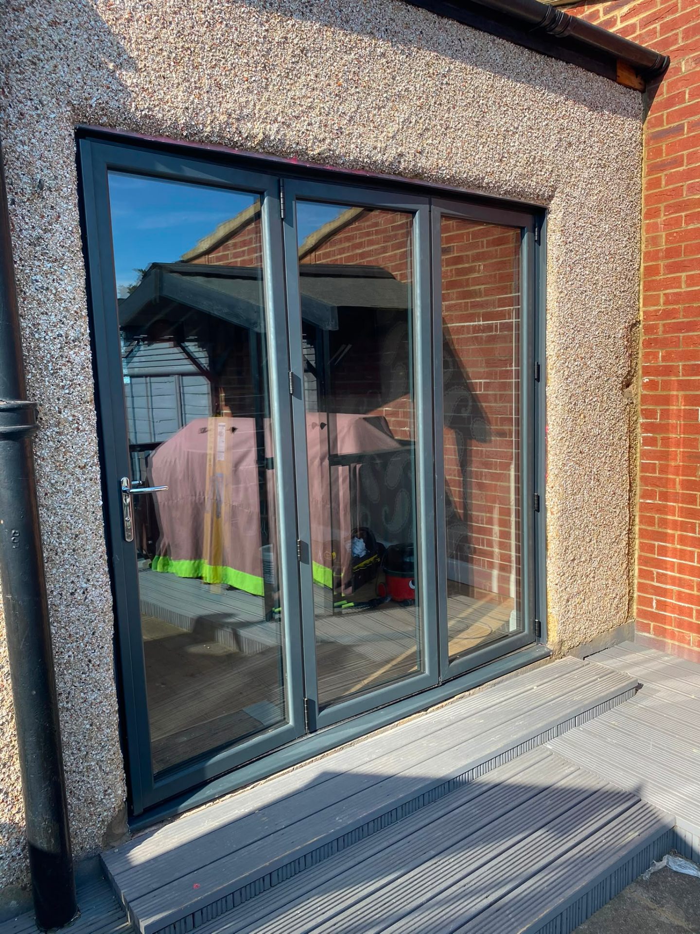 Aluminium bi-fold doors installation by Rural Windows in Chester & North Wales