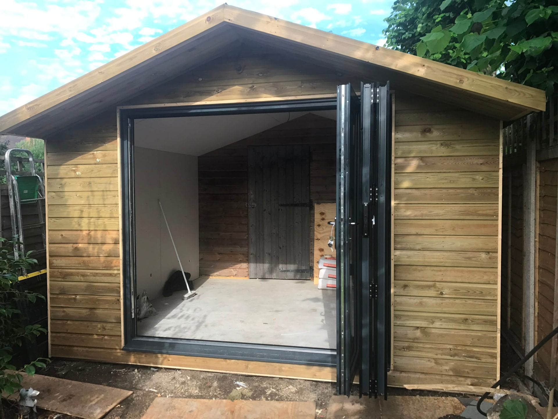 Aluminium bi-fold doors installation by Rural Windows in Chester & North Wales