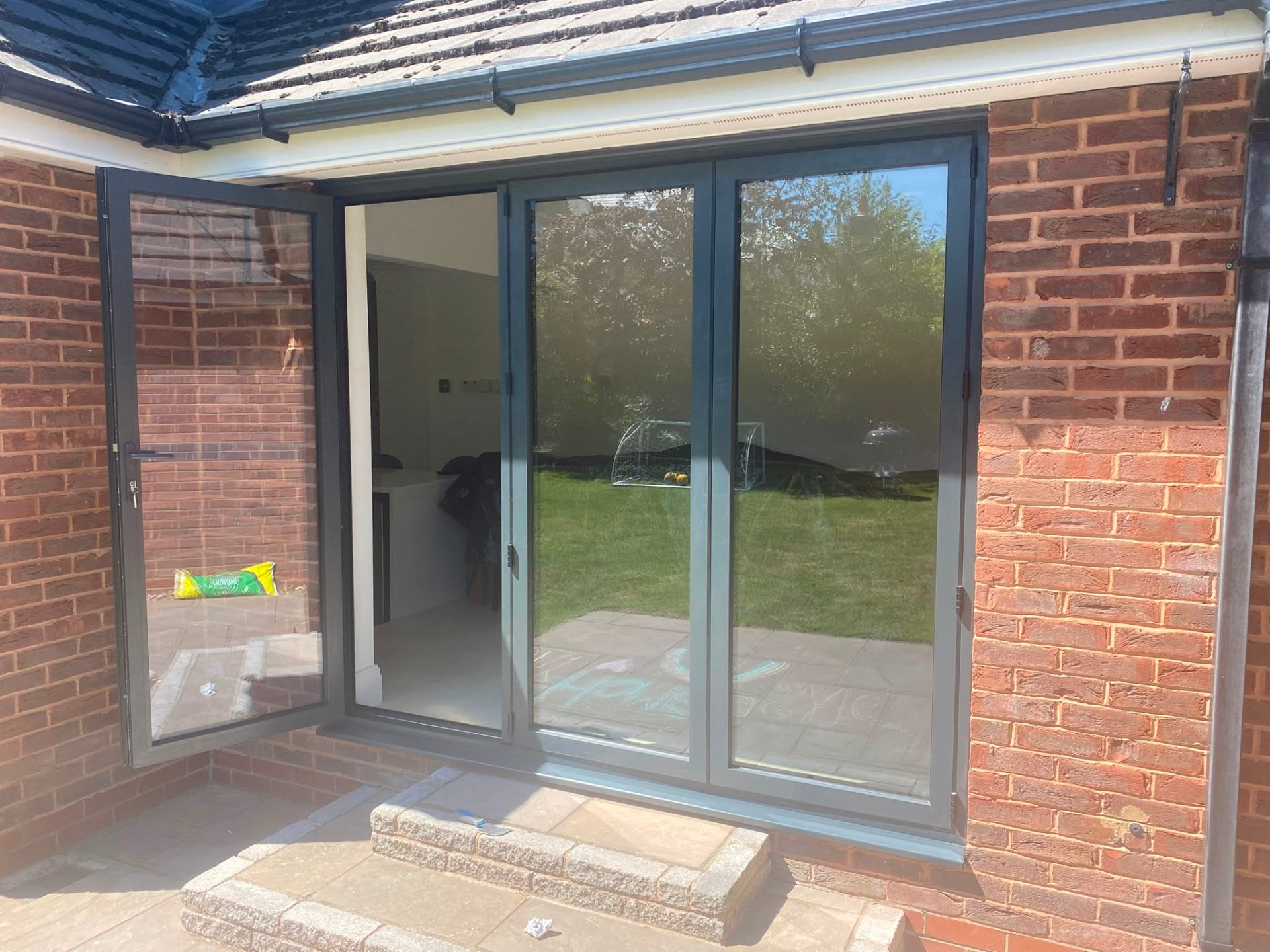 Aluminium bi-fold doors installation by Rural Windows in Chester & North Wales